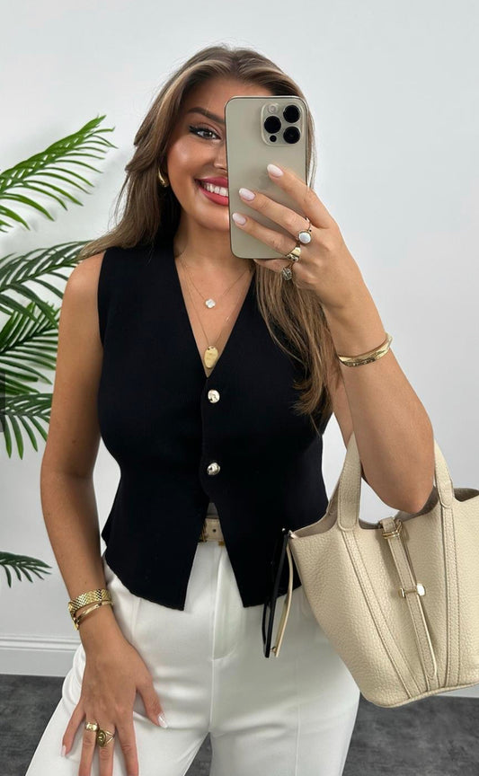 Knitted vest with gold buttons